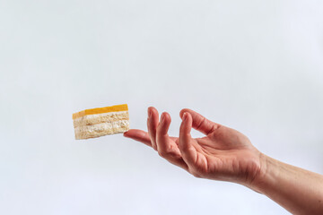 Composition of hands and cakes. Delicate hands and delicious cakes. Cakes floating in the air. Sorcery and magic, levitation