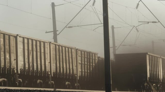 Freight Train With Carrier Wagons Row Moving, Railway Heavy Cargo Transportation Harm To Environment. Global Problem As Dirty Air, Bad Ecology, Nature Pollution, Dangerous Exhaust Smoke Or Diesel Dust