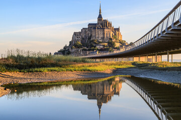 Mont Saint Michel, an UNESCO world heritage site in France. Abbey, panoramic view, reflection in water. Normandy, Northern France, Europe. 