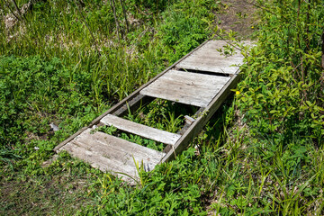Fototapeta premium little wooden bridge with missing planks