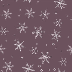 Seamless winter snowflakes pattern. New year and Christmas holidays background. Hand drawn wrapping paper print design.
