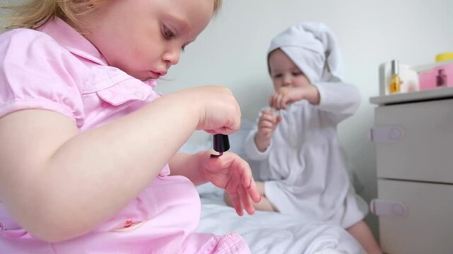girls at home play in a beauty salon 