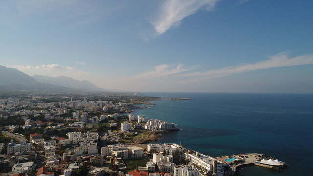 Cyprus Kyrenia Drone Footage from sky mountains city view Mediterranean sea Girne North Cyprus KKTC blue color best holiday summer sunny