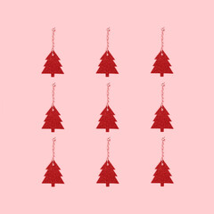 Fototapeta na wymiar Layout of red glittering New Year decorations in a fir-tree shape on a pink pastel background. Festive minimal composition.
