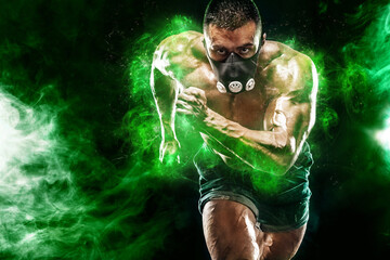 Athlete in green energy lights. Strong athletic man sprinter in training mask, running, fitness and...