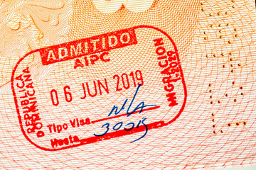 Passport page with Dominican Republic border stamps. Travel, journey and tourism concept