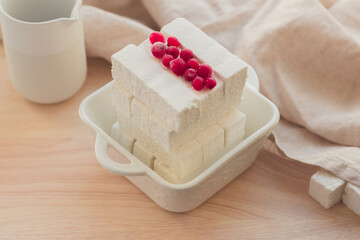 Handmade Apple pastille with fresh berries on a light background