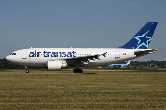 HOOFDDORP, THE NETHERLANDS - AUGUST 26, 2013: Canadian Air Transat Airbus A310-300 with registration C-GTSY rolling on taxiway V of Amsterdam Airport Schiphol.