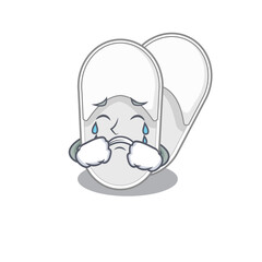 Caricature design of hotel slippers having a sad face