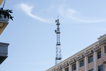Fototapeta na wymiar Telecommunications Antenna Tower with 5G cellular network in the city