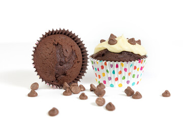 Chocolate cupcake/muffin in spotty cake case shot against white background