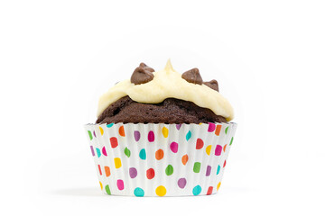 Chocolate cupcake/muffin in spotty cake case shot against white background