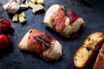 succulent chicken breasts filled with creamy parmigiana stuffing and wrapped in prosciutto