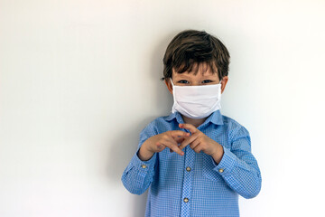Caucasian boys wear white mask protection for protect virus or bacteria isolated on white background.Little boy staying healthy by using a mask to protect him against coronavirus covid-19.Coronavirus.