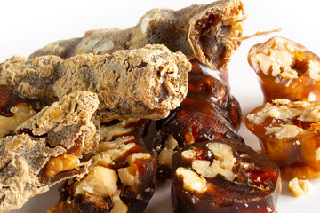 Walnuts on a string dipped in starch grape molasses. Churchkhela. Walnut sujuk.