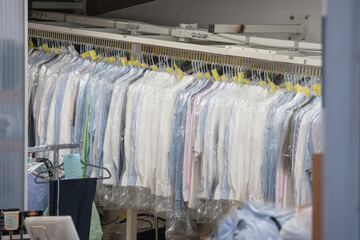 Clean clothes on hangers in the Laundry room