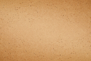 Sheet of brown paper or cardboard texture background.