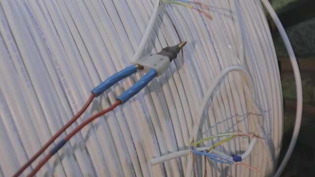 Testing wire quality in an ea factory, checking wire quality close-up.