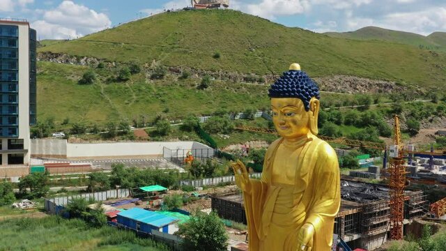 Aerial view of Big Golden Buddha Statue and Memorial on Zaisan Tolgoi, Mongolia, 4k