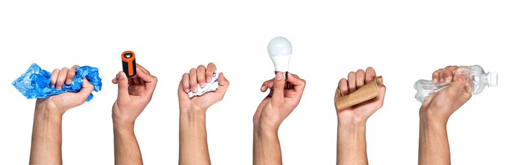 Save the planet. Different types of waste in the hands on a gray background. Sort garbage and...