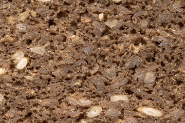 Macro photo of German dark rye bread, known as Pumpernickel