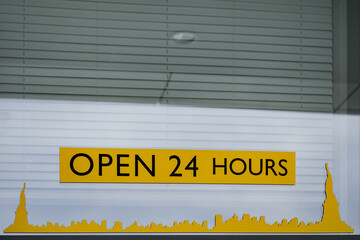 open 24 hours written on the wall