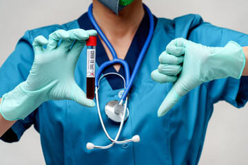 medical doctor nurse woman wearing protective mask and gloves - holding positive coronavirus...