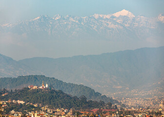 Swayambhunath stupa also called Monkey Temple in Kathmandu, Nepal. In the background the Langtang range, a subrange of the Himalayas.