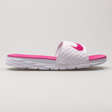 VIENNA, AUSTRIA - JUNE 14, 2018: Nike Benassi Solarsoft white and magenta sandal on white background.