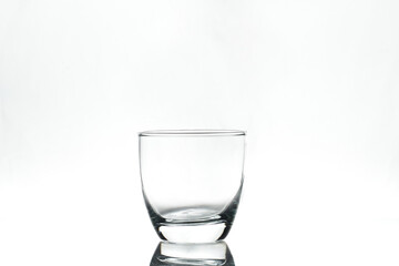 Empty glass on white background. Isolated. Backlight.