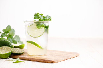 Lemonade or mojito cocktail with fresh lime and mint leaves
