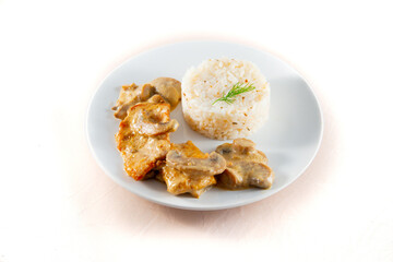 Chicken Breast in Creamy White Wine and Mushroom Sauce. Isolated on white.