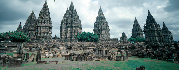 Yogyakarta Indonesia June, 08 2020: Prambanan temple is a Hindu temple compound included in world heritage list in the night. Monumental ancient architecture, carved stone walls. - obrazy, fototapety, plakaty