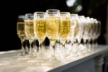 Glasses filled by champagne. Soft focus on the front glass.