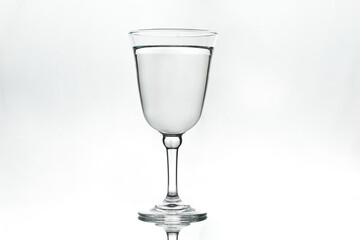 Full glass on white background. Isolated. Backlight.