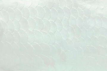 White ceramic tiles in the form of scales. Mosaic Tiles on the wall © Ivanna