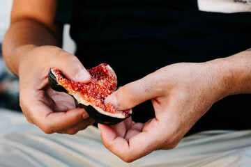 man about to eat a fig