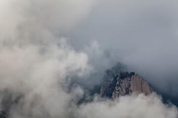 Bavella needles at Corsica I Forchi di Bavedda mountain with clouds