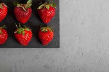 Fresh Strawberry On Grey Concrete Background. 