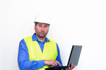 Attractive caucasian Technician Holding Laptop Over White Background.Makes all kinds of grimaces-eyes closed, upset, thinking, shows thumb up, and ok gesture...