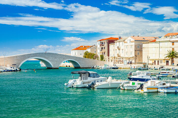 Beautiful town of Pag on Adriatic sea in Dalmatia, Croatia, old stone bridge, waterfront and marina with boats
