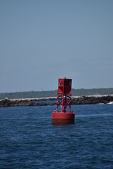 red buoy in breakwater ocean