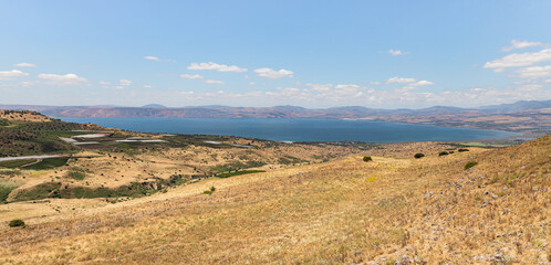 Fototapeta na wymiar Panoramic view from a hill located on the Golan Heights in northern Israel on the Sea of Galilee