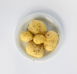 Boiled peeled potatoes on white