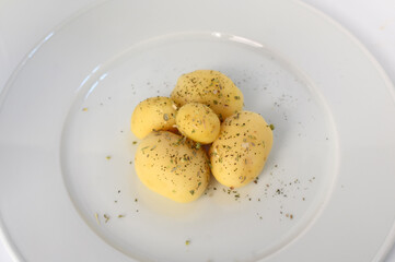 Boiled peeled potatoes on white