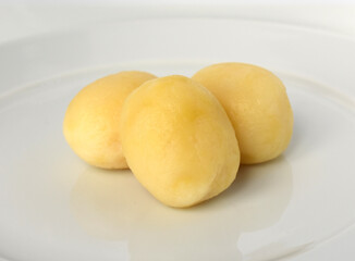 Boiled peeled potatoes on white
