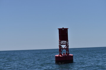 bright red bouy on the ocean