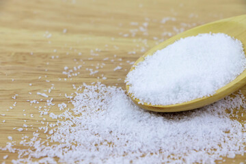 Monosodium glutamate. MSG on wooden table