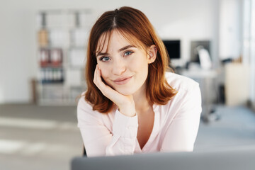Fototapeta premium Pretty young office worker with a lovely smile