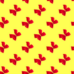 Seamless pattern with red Christmas bows on a yellow background. Minimal isometric texture. Use for blackboard printing on fabric.